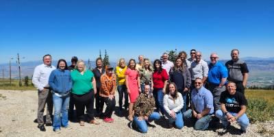 Central Utah Leaders group on the mountain top looking over the valley below